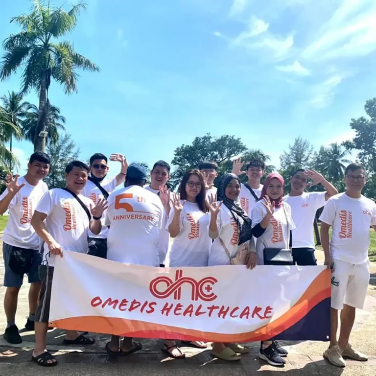 Corporate healthcare team event t-shirts Malaysia - Medical vendor staff wearing custom DTF heatpress printed white Orensport microfiber shirts for team building activity (QD04)