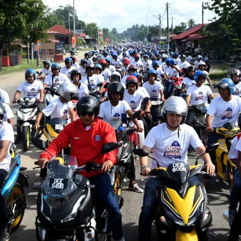 Youth motorcycle convoy event t-shirts Malaysia - participants wearing custom DTF heatpress printed white Crossrunner microfiber shirts (CRR3600) for community ride