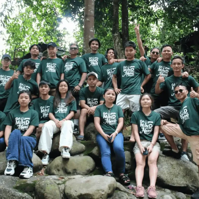 Community gathering t-shirts Malaysia - Local group wearing custom silkcreen printed green North Harbour 160gsm cotton shirts (NHR1100) for outdoor event near a waterfall.
